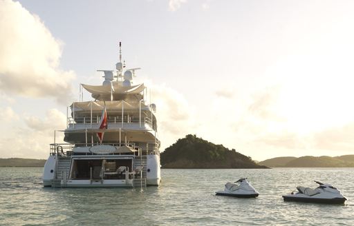 water toys in the water at sunset behind the aft deck of charter yacht the wellington 