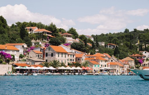 Town of Maslinica in croatia, beautiful stone cobbled buildings overlooking the water 