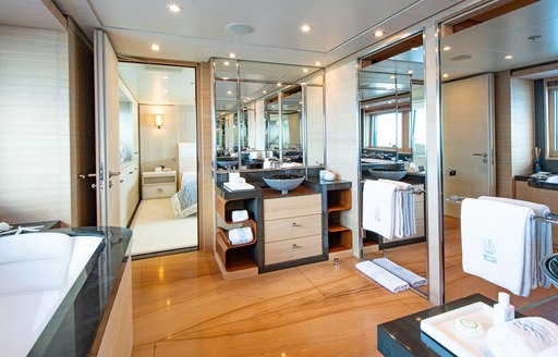 master cabin en suite on luxury yacht spirit with marble tub and mirrored sink