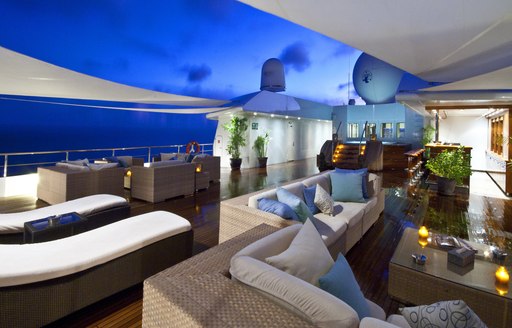 beautifully appointed sundeck of charter yacht Lauren L at nighttime 