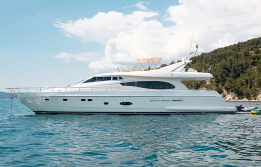Charter yacht HASARD at anchor in a bay