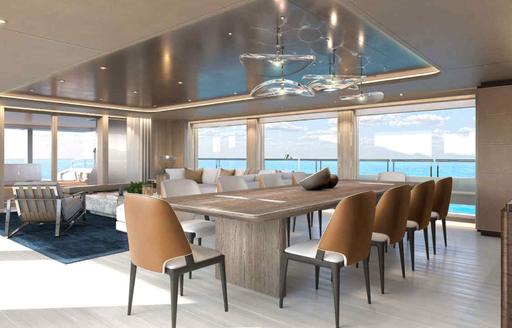 Charter yacht ALVA interior dining area with long table and large windows
