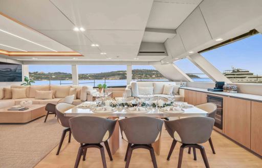 Charter yacht AMITATU interior dining table and chairs