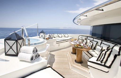 Jacuzzi and exterior seating on board OceanCo charter yacht ALFA NERO