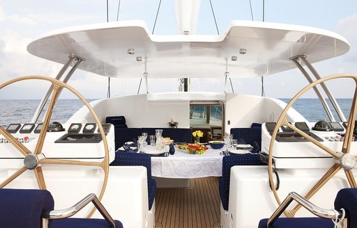 dining table in cockpit of superyacht NOSTROMO is laid up for dinner