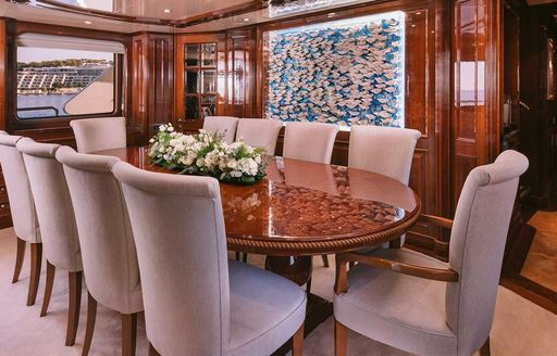 Charter yacht OAK interior dining area with long table