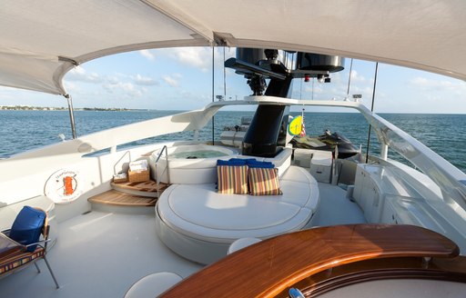 Jacuzzi, sunpads and corner bar on sundeck of motor yacht TEMPTATION