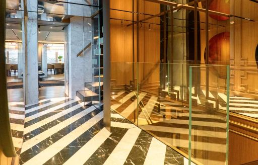Corridor and striped flooring onboard charter yacht RAJA²