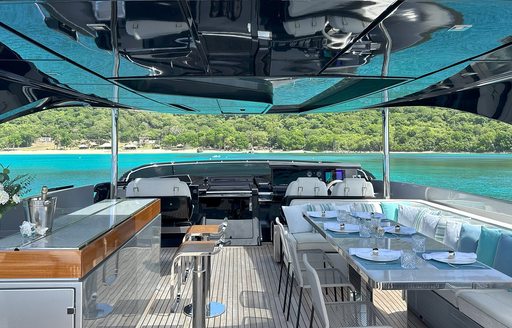 Charter yacht NOI flybridge with dining set up