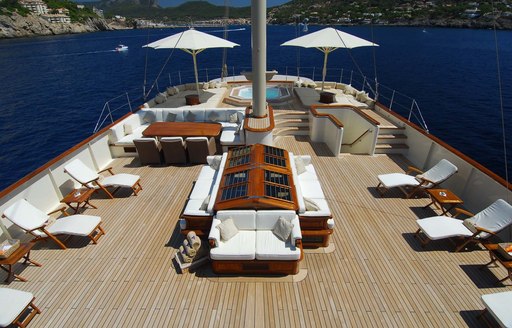 expansive sundeck with loungers, seating and Jacuzzi aboard motor yacht NERO