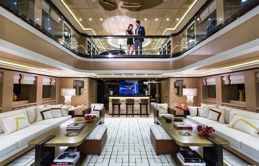 two-level atrium spanning across main deck and upper deck aboard superyacht AXIOMA 