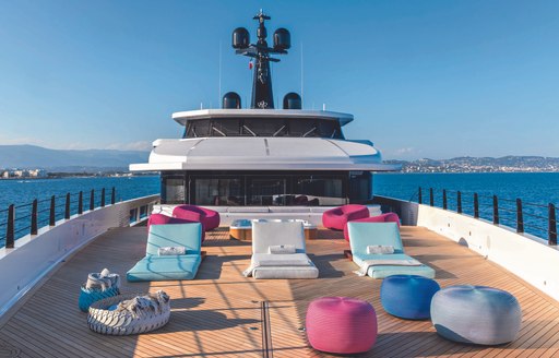 spread of sunbeds on large sundeck onboard motor yacht RIO