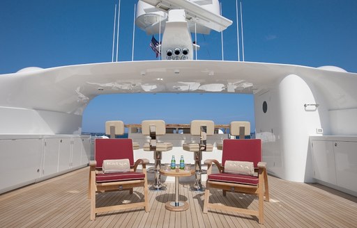 The bar and surrounding seating on the exterior of luxury yacht KATYA