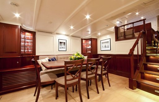 dining area in bright and airy main salon of charter yacht ANNAGINE 