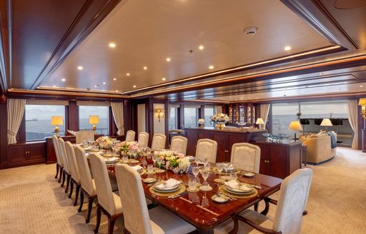 Charter yacht GIGIA interior dining room with long table