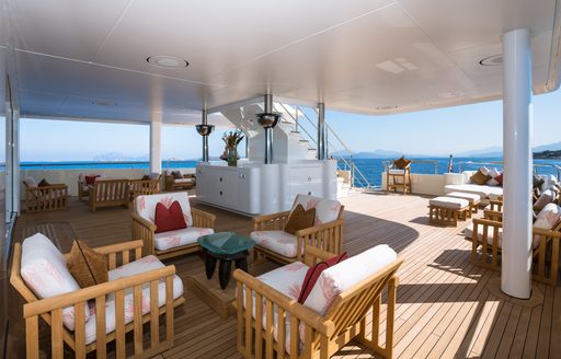 chairs on expansive deck area on board motor yacht Coral Ocean