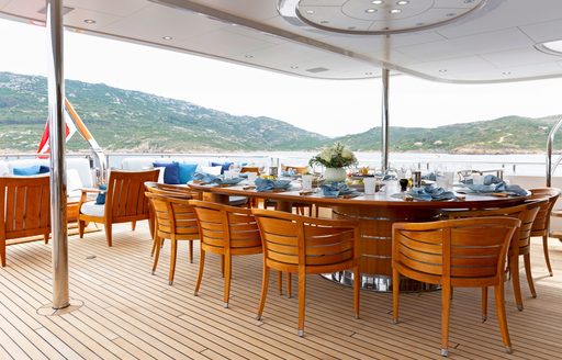 Alfresco dining table onboard charter yacht ADVENTURE