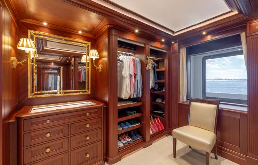 Charter yacht GIGIA walk in wardrobe with window and chair