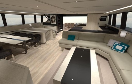 Sleek decked interior of Rua Moana catamaran showing sofas and tables