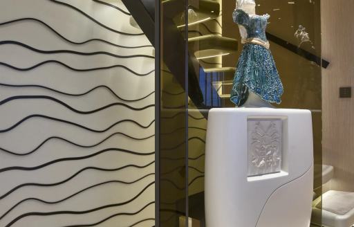 Superyacht charter AWANDRA art sculpture by staircase
