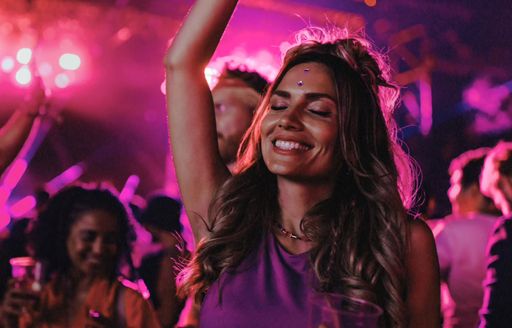 Charter guest dancing at Bla Bla Bar with a drink