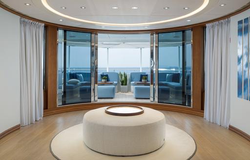 Charter yacht TALIA interior with doors to exterior deck space