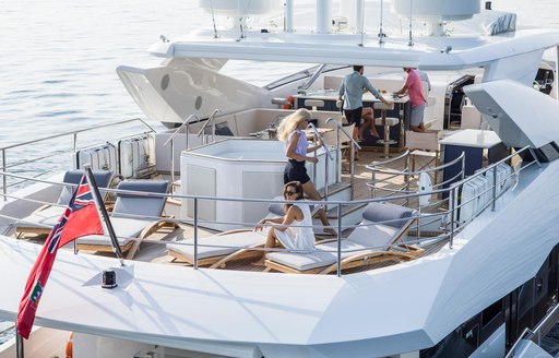 sun loungers, spa pool and bar on the sundeck of luxury yacht FLEUR