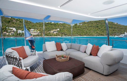 Charter yacht WABASH exterior seating area with sofa and armchairs