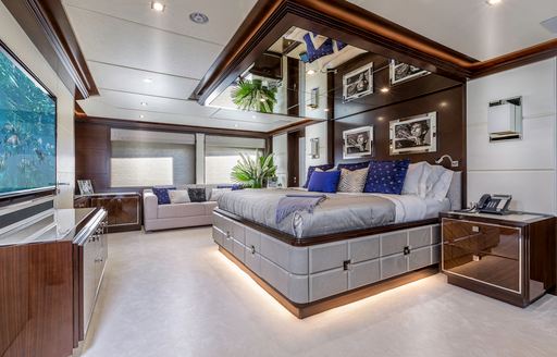 contemporary master suite with rock n roll photography on board luxury yacht ‘King Baby’ 