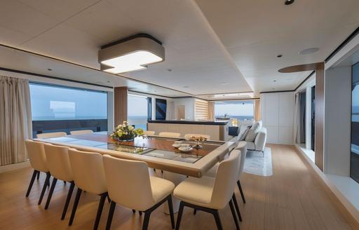 Charter yacht MAVERICK interior dining area with long table