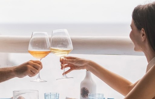 Charter guests toasting wine at Il Riccio