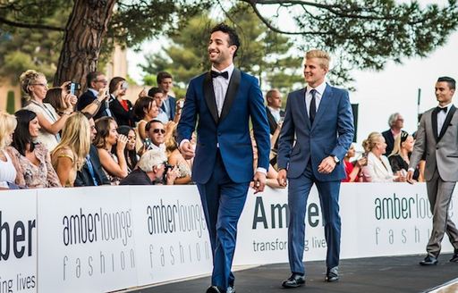 Drivers on catwalk at the Amber Lounge fashion show in Monaco