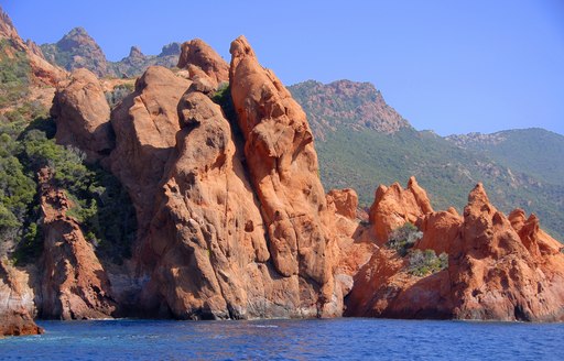 spectacular orange rock formations of Scandola National Park in Corisca