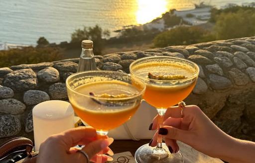 Two cocktails being toasted