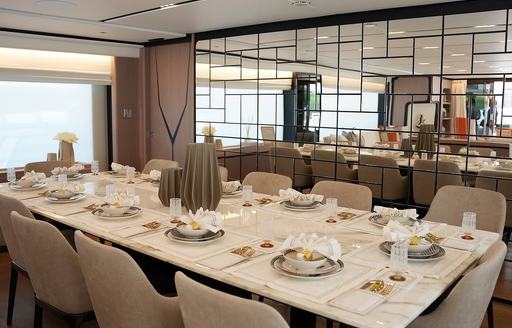 Interior dining area onboard charter yacht GEULUNEL