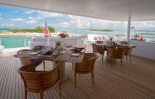 Aft deck alfresco dining set-up on superyacht DREAM