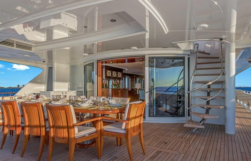 al fresco dining area on the main deck aft of motor yacht AVALON 