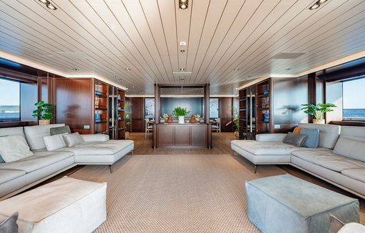 Overview of the interiors onboard luxury yacht charter GALILEO with spacious chaise-longue sofas to port and starboard