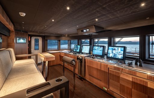 Overview of the bridge with instrumentation and cream seats onboard charter yacht SUNRISE