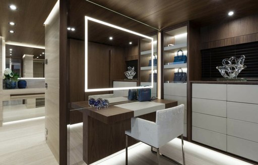 small study space on board superyacht utopia iv with discreet light panels in the mirror