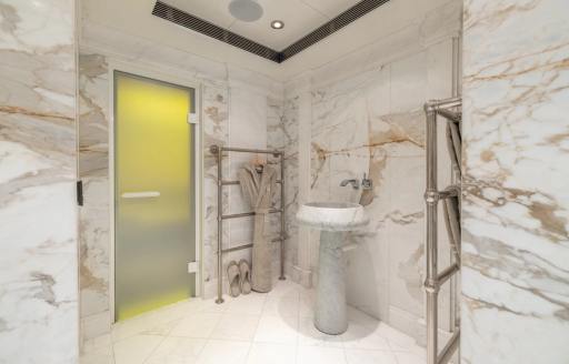 Ensuite with marble walls and a sink unit onboard charter yacht CARINTHIA VII 
