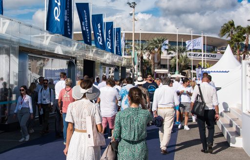 Cannes Yachting Festival exhibitor stands with visitors walking by