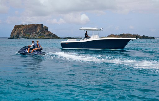 Charter guests on luxury yacht Zoom Zoom Zoom's  jet ski and tender 