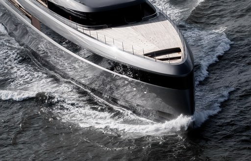 Overhead view looking down on the bow of M/Y OBSIDIAN, surrounded by sea.