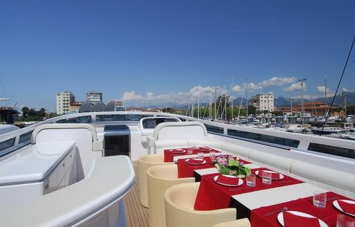 table set for alfresco dining on flybridge of charter yacht ‘Paris A’ 