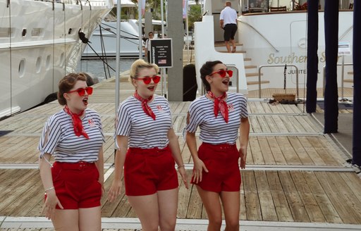 women in sailor suits dancing at flibs