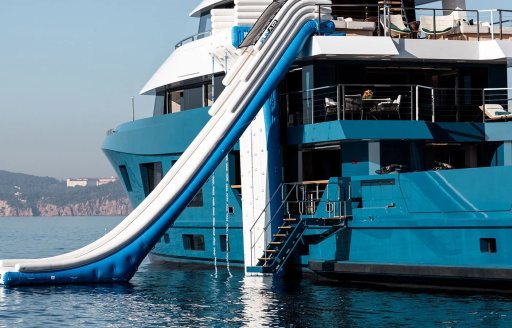 Water-level view of waterslide attached to charter yacht KING BENJI