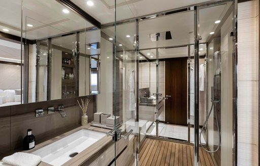 jacozami yacht with glass shower and grey toned sink 