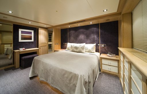 Double guest cabin onboard yacht charter CYAN with central berth and a dressing area adjacent