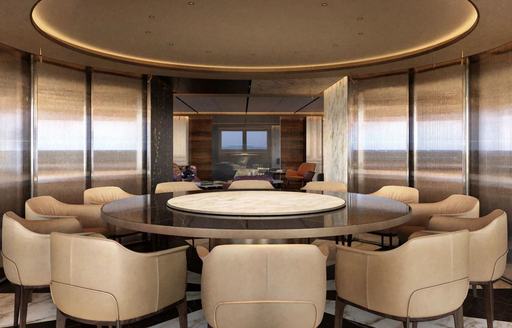 Circular dining table onboard charter yacht RAJA² 